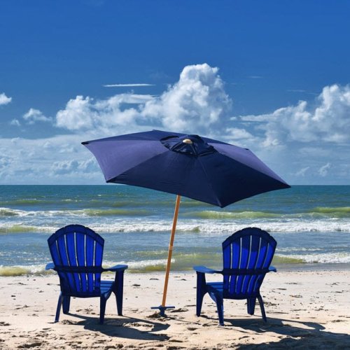vacation-landscape-blue-adirondack-chairs-under-crop avon-beach-view
